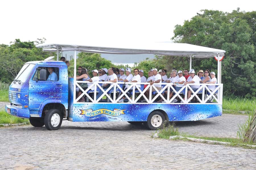 Buzios: City Tour by Trolley with 12 Beaches and Pickup - A roofed, open-side trolley that keeps the day moving
