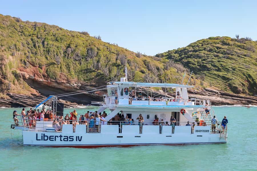 Full day tour to Búzios - Premium All Inclusive - The catamaran experience: two decks, DJ, and real cruising energy