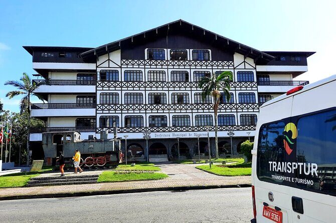 Germanic Roots Tour Blumenau and Pomerode - Blumenau City Hall and the iron bridge with a locomotive story